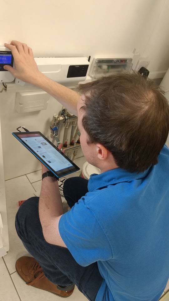 Bumfords engineer diagnosing an underfloor heating system