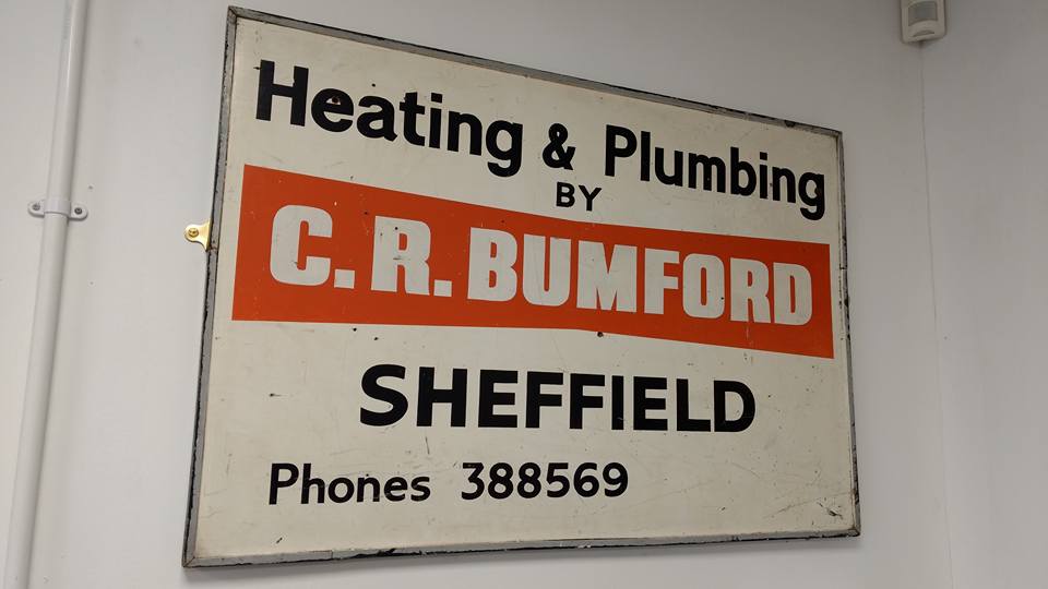 An original Bumford Heating sign