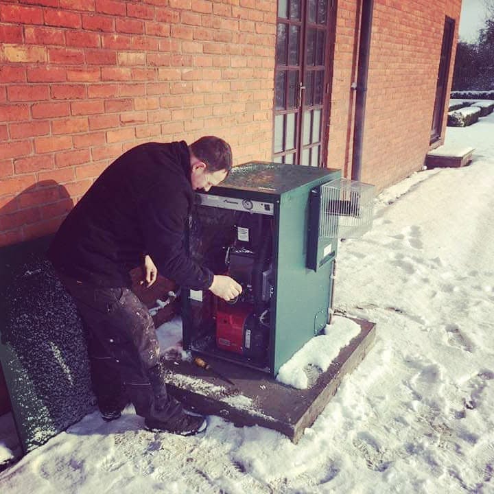 Bumfords attending an oil heating system in winter conditions