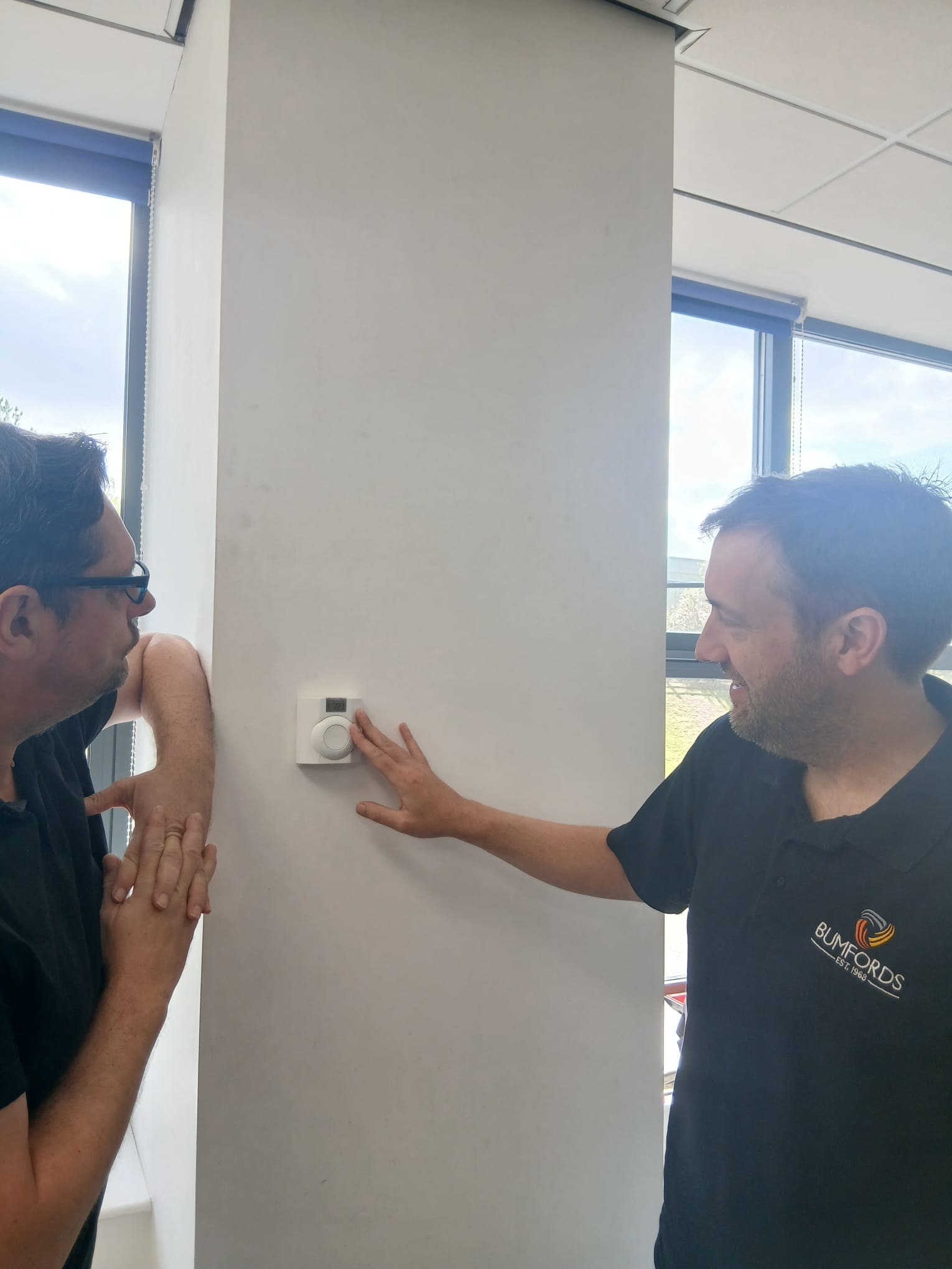 Robin from Bumfords explaining a completed installation to a customer