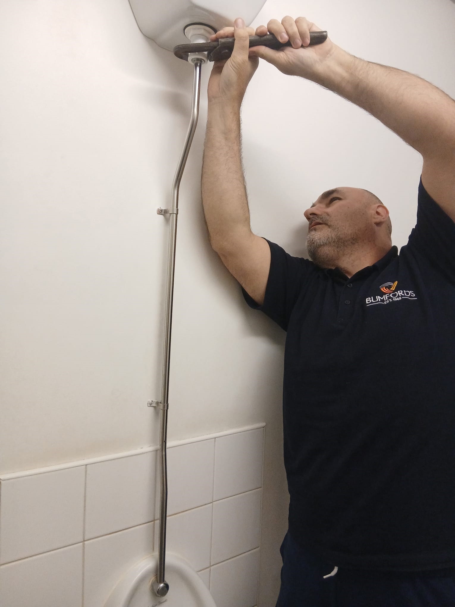 Craig from Bumfords undertaking commercial plumbing work