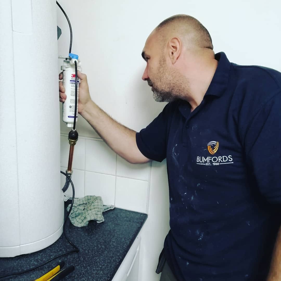Bumfords engineer working with commercial water equipment