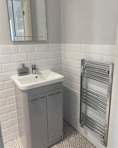 Bathroom towel radiator installed by Bumfords